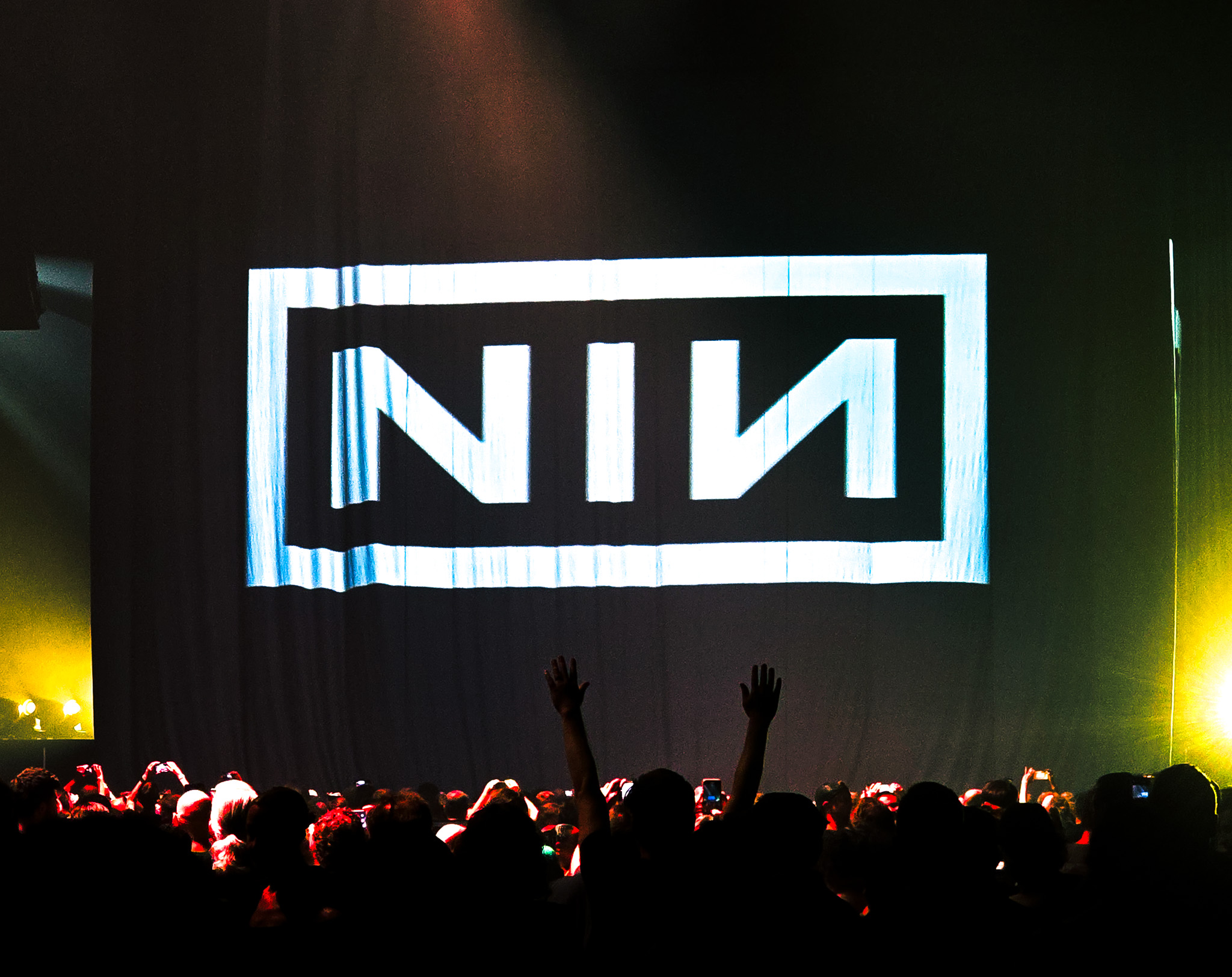 NIN logo superimposed over curtain